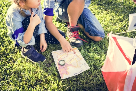Kids finding direction on a map