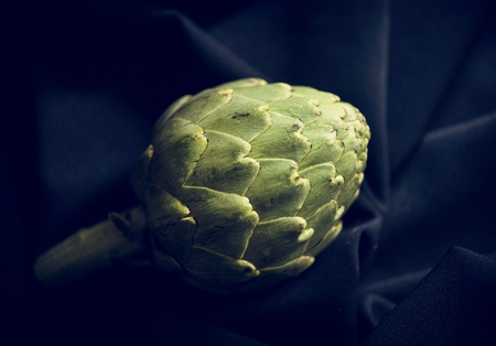 Artichoke raw produce on black background