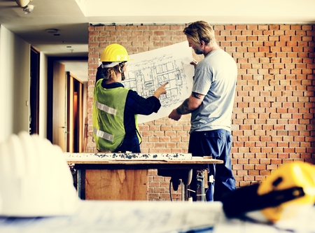 Construction team working on a blueprint