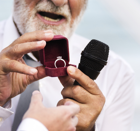 Clergy showing the wedding ring