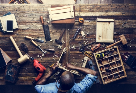 Aerial view of carpenter man working with tools equipment set