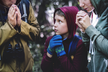 Family lost and cold in a forest