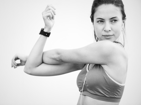 Caucasian woman stretching before exercise