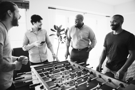 People playing foosball together at home