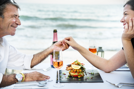Couple enjoying a romantic dinner at the beach