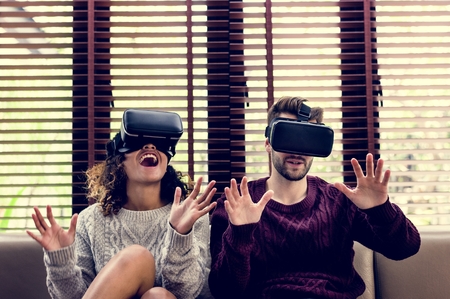 Young couple using VR together