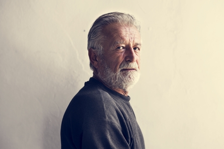 Side view of elderly caucasian man with thoughtful face expression