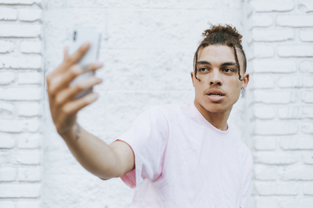 Man taking a selfie in downtown