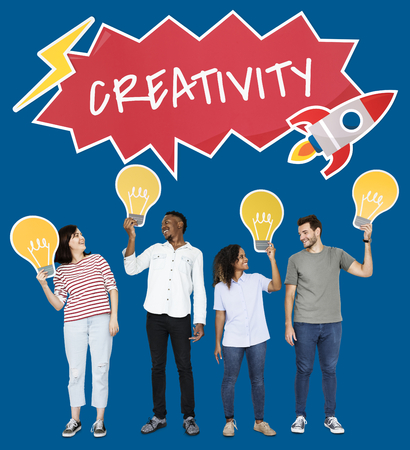 People holding startup ideas and light bulb cardboard cutouts