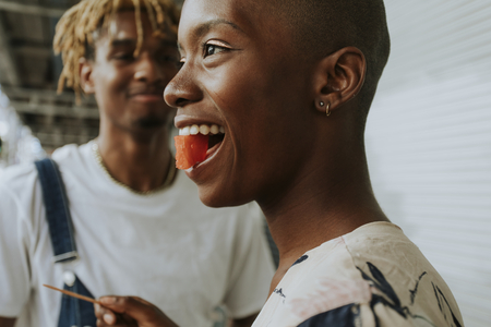 Couple snacking on fruit in the summer
