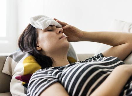 Woman with a cold and high fever