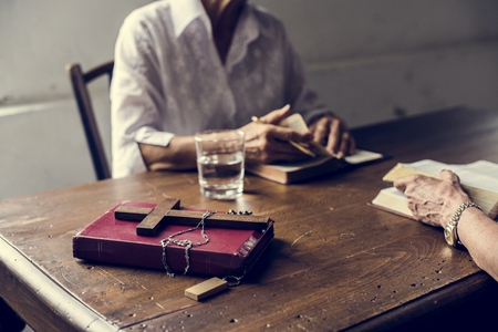 Christianity people praying reading bible