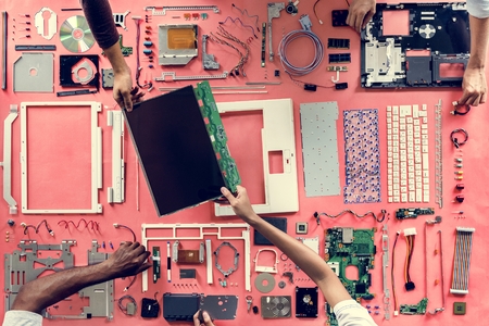 Hands holding a computer component part