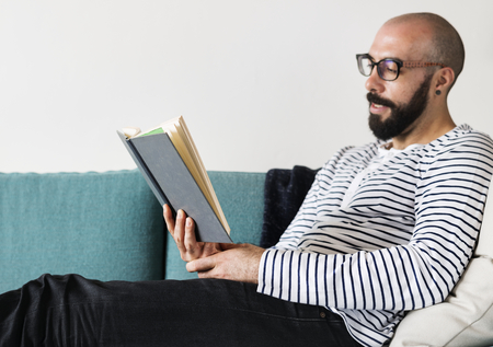 Closeup of man reading a book