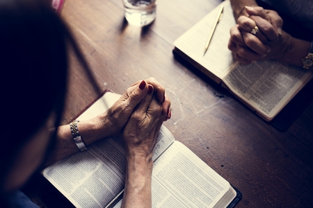 Christianity people praying reading bible