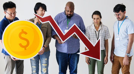 Diverse people standing and holding currency logo and graph