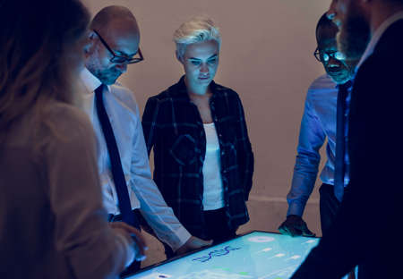 People in a technology meeting with cyber space table