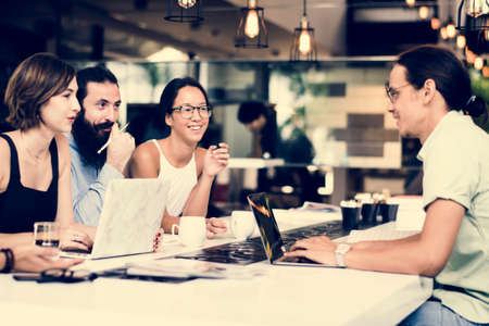 People working together in a cafe