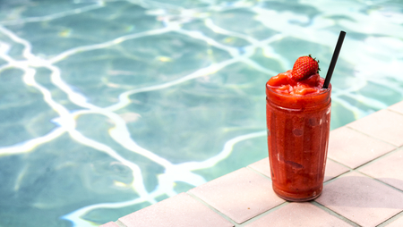 Strawberry smoothie by the swimming pool