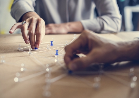 Hands holding connecting pin network