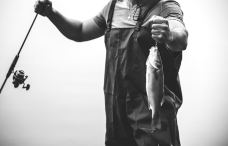 Photo for Man fishing by the lake - Royalty Free Image