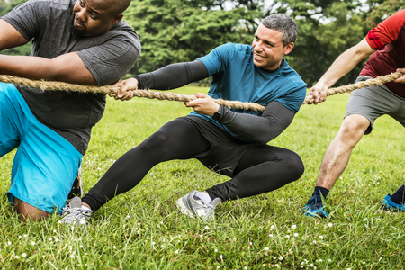Team competing in tug of war