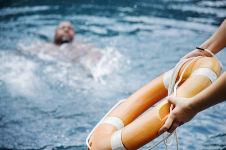 Man being rescued from the water