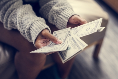 Closeup of woman counting money