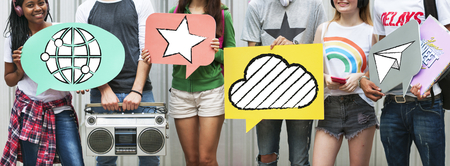 Teens holding social media icons