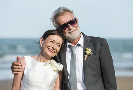 Senior couple getting married at the beach