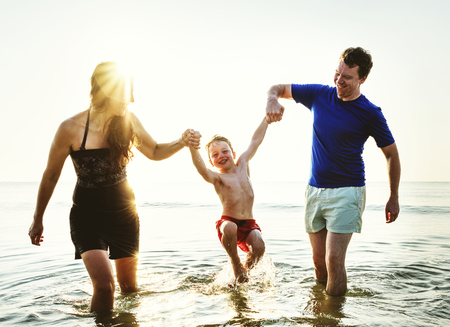 Family playing together at the beach