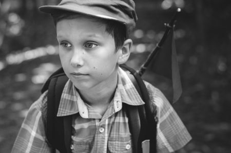 Boy walking into the forest