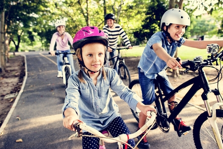 Family on a bike ride in the park