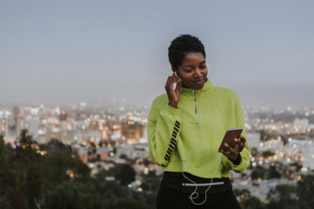 Woman listening to music from a phone