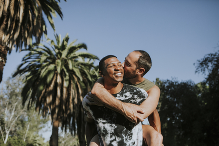 Gay couple hugging in the park
