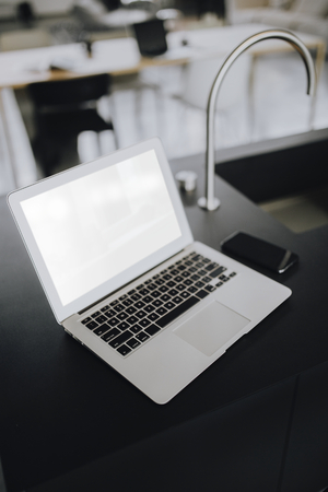 A laptop on a black counter