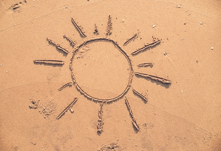 Sun drawn in the sand