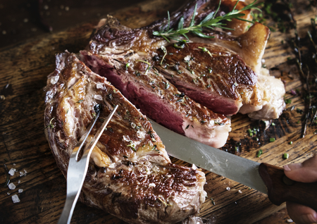 Tomahawk steak on a wooden board food photography recipe idea