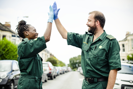 Team of paramedics doing a high five