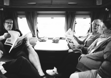 Group of senior people reading the newspaper