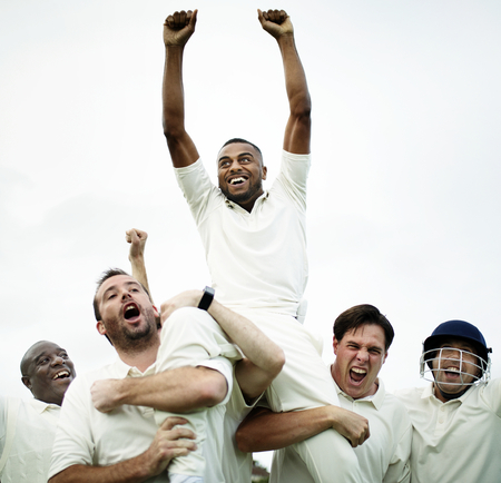 Cheerful cricketers celebrating their victory