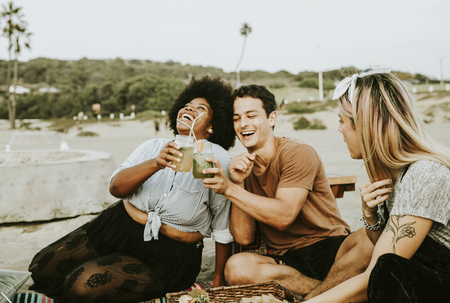 Diverse friends enjoying a beach party