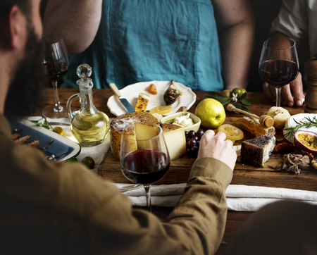 People enjoying a cheese platter