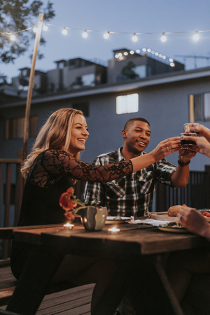 Friends toasting with red wine