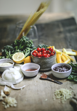 Fresh organic vegetables and ingredients prepared on a cutting board