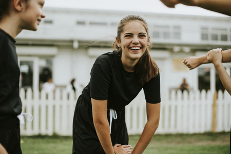 Girls stretching on the field
