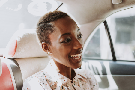 Cheerful woman in a car