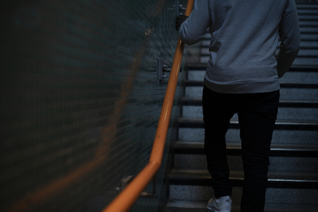 Man walking up the stairs