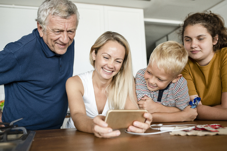 Family watching a video clip on a phone