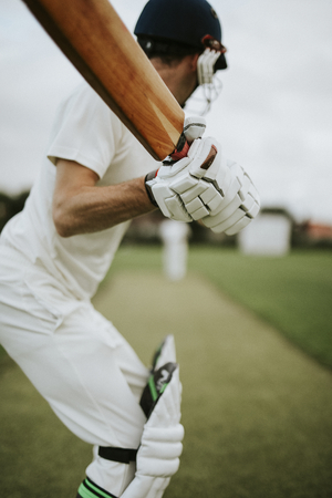 Cricketer on the field in action